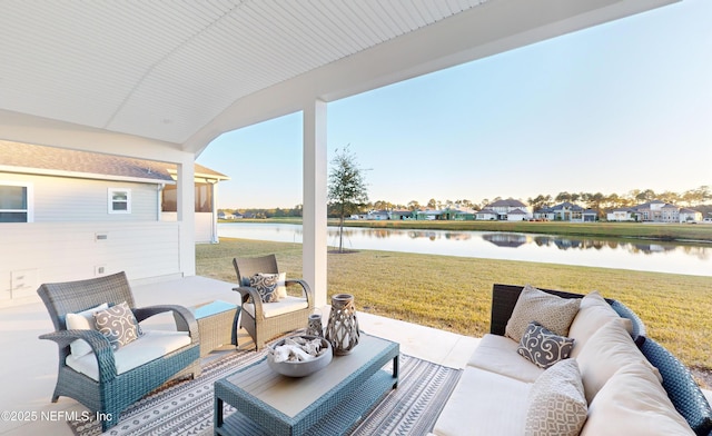 view of patio / terrace with outdoor lounge area and a water view