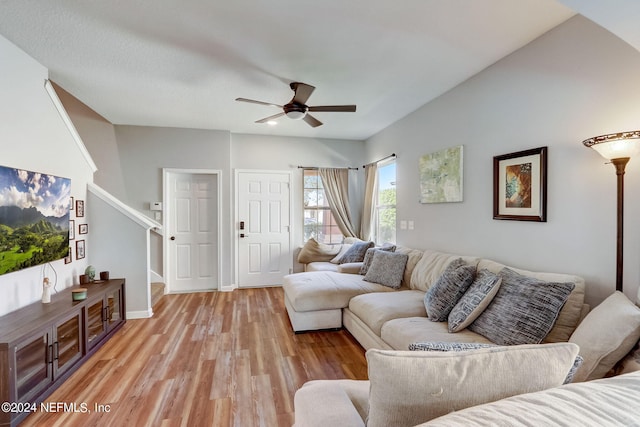 living room with ceiling fan and light wood-type flooring