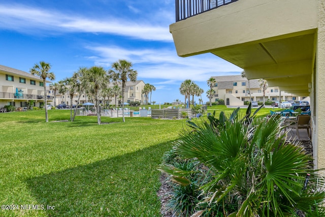 view of yard featuring a balcony