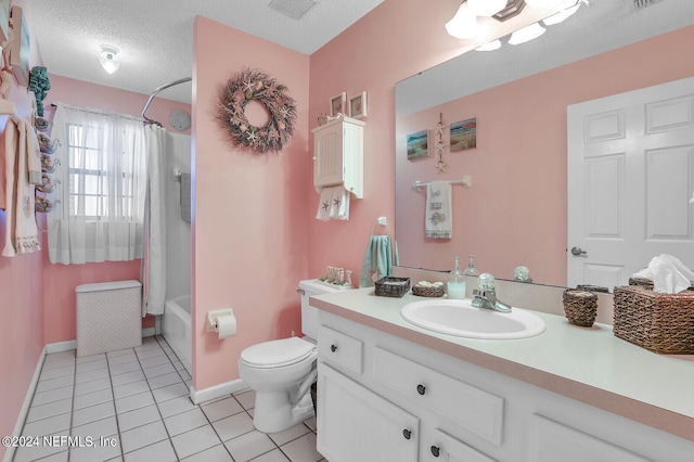 full bathroom with tile patterned flooring, shower / bath combination with curtain, a textured ceiling, toilet, and vanity