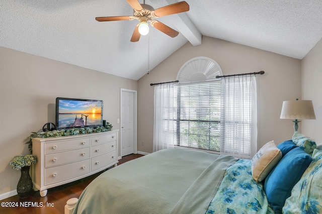 bedroom with ceiling fan, lofted ceiling with beams, dark hardwood / wood-style flooring, and a textured ceiling