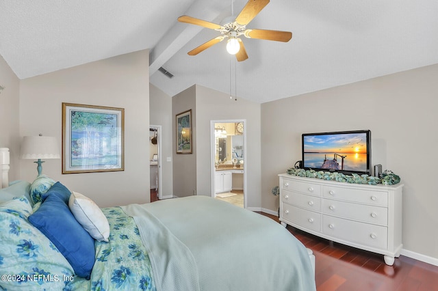 bedroom featuring ceiling fan, lofted ceiling with beams, dark hardwood / wood-style flooring, and connected bathroom