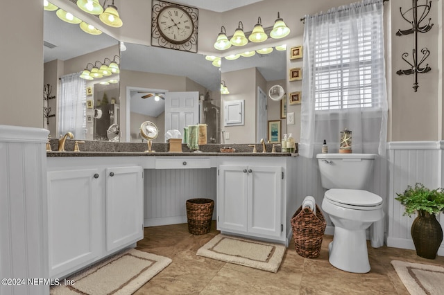 bathroom featuring ceiling fan, vanity, and toilet