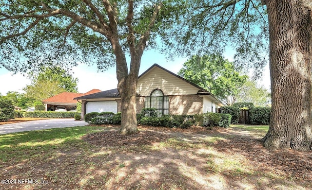 ranch-style house featuring a garage