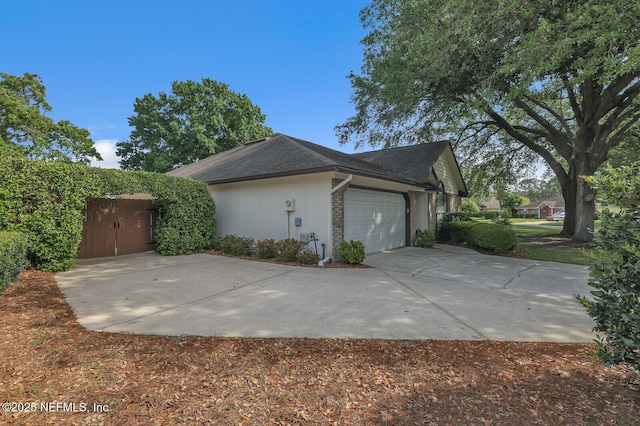 view of side of home with a garage