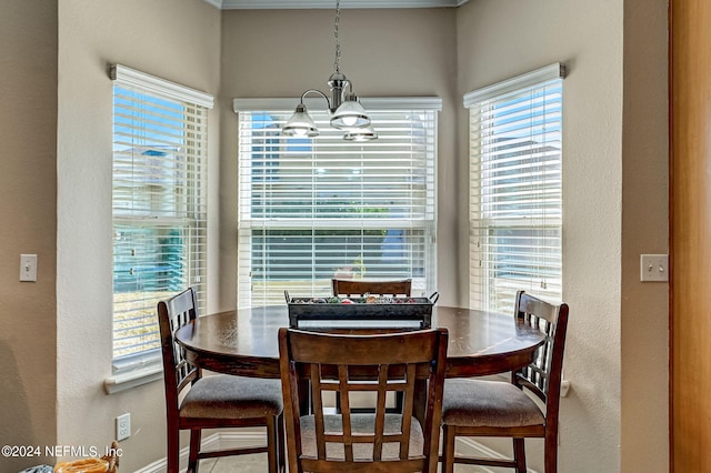 dining area featuring a notable chandelier