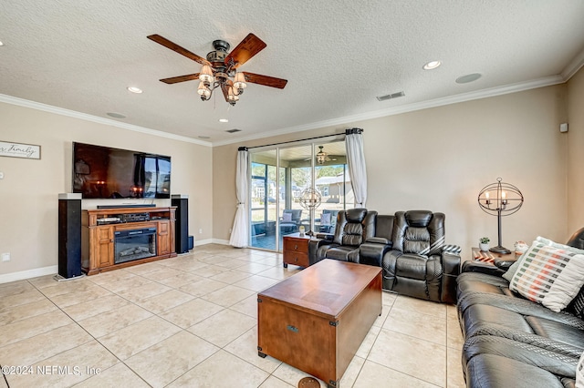 tiled living room with ceiling fan, a textured ceiling, and crown molding