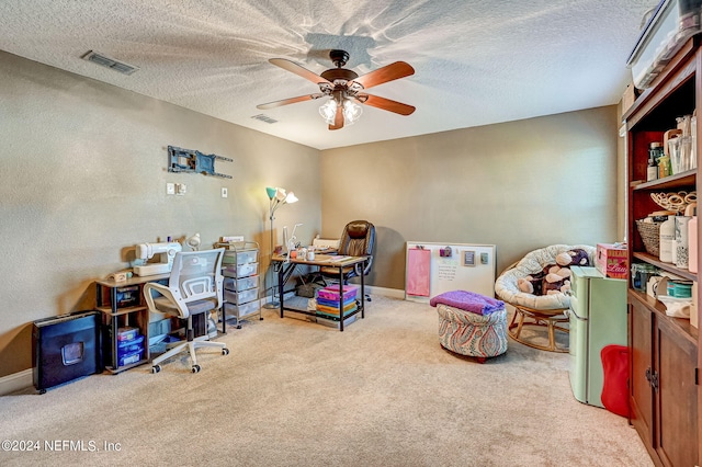 interior space with a textured ceiling and ceiling fan