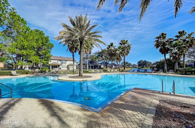 view of swimming pool featuring a patio