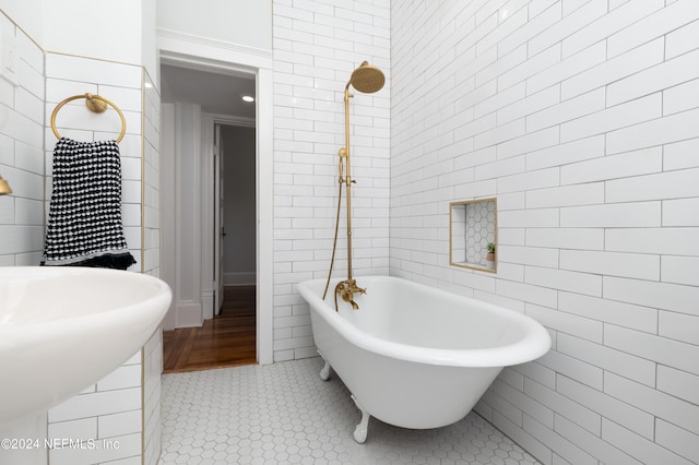 bathroom featuring tile floors and tile walls