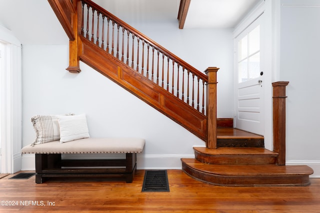 staircase featuring hardwood / wood-style floors