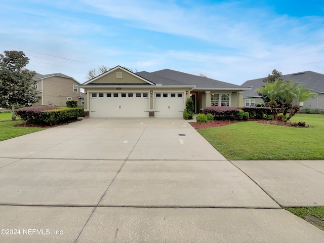 single story home featuring a front yard and a garage