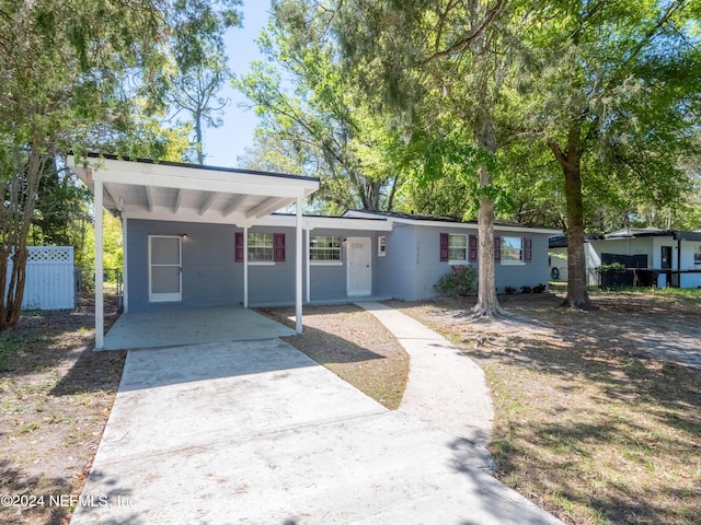 ranch-style home with a carport