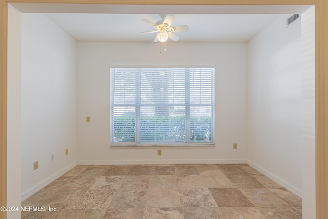 spare room featuring ceiling fan