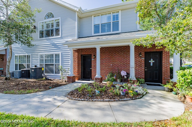 view of front of property with central AC unit and covered porch