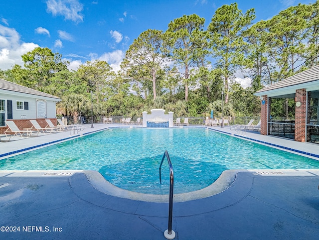 view of pool featuring a patio