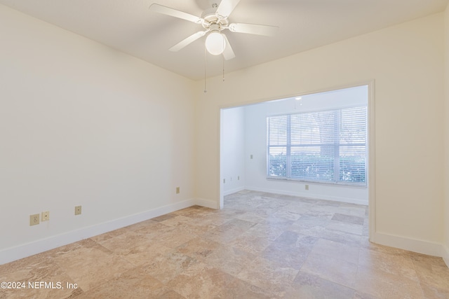 spare room with ceiling fan