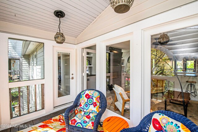 sunroom with lofted ceiling and french doors