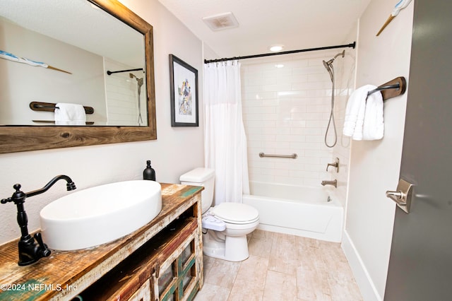 full bathroom featuring vanity, a textured ceiling, toilet, and shower / bathtub combination with curtain