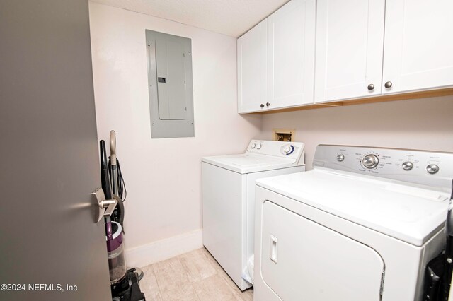 laundry area with cabinets, washer hookup, and separate washer and dryer