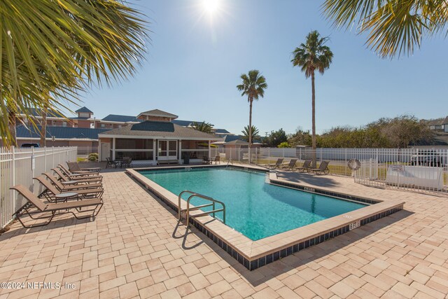 view of swimming pool featuring a patio area