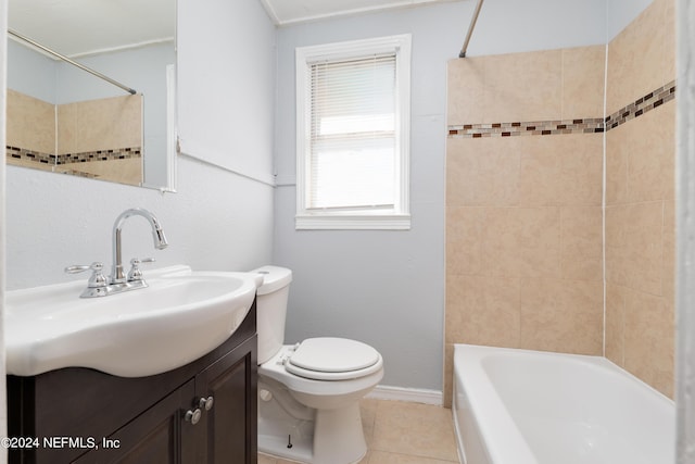 full bath featuring bathtub / shower combination, toilet, vanity, baseboards, and tile patterned floors