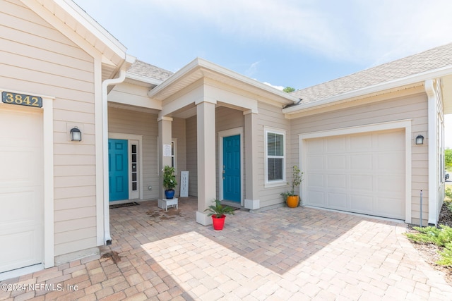 doorway to property featuring a garage