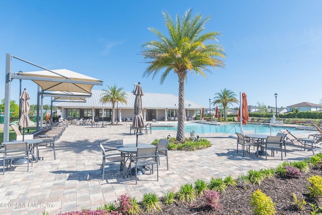 view of patio featuring a community pool