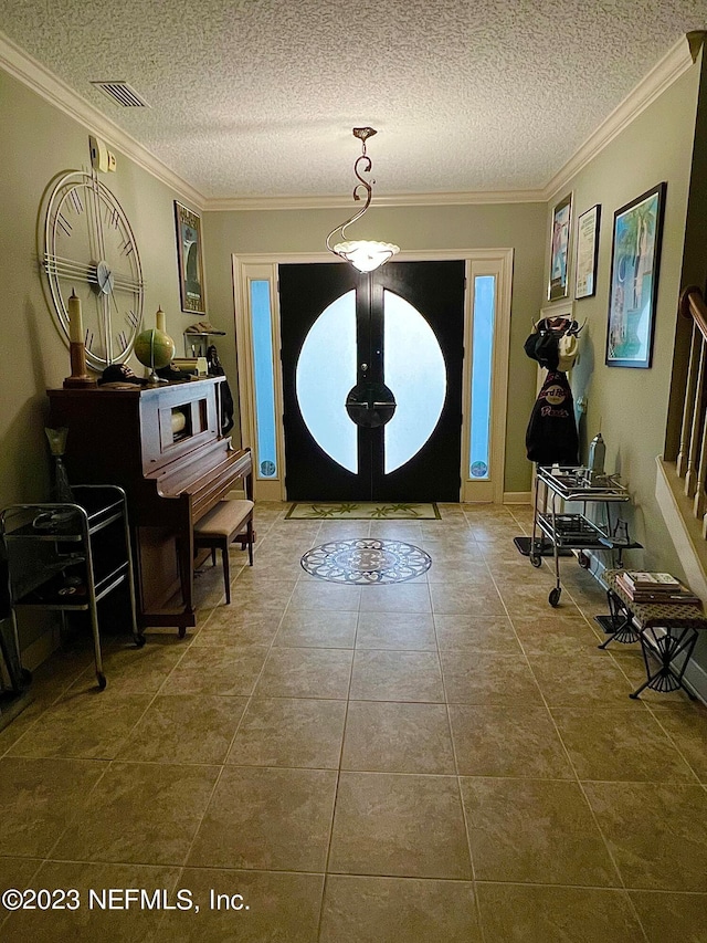 entrance foyer with french doors, crown molding, a textured ceiling, and light tile flooring