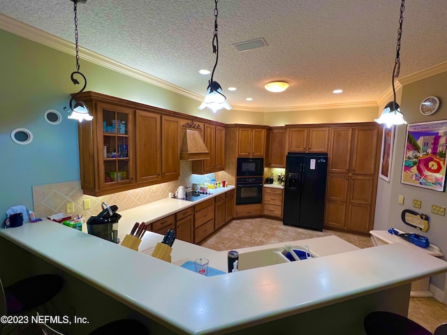 kitchen featuring hanging light fixtures, backsplash, light tile floors, kitchen peninsula, and black appliances