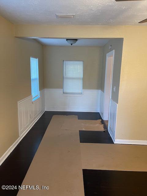 spare room featuring a textured ceiling