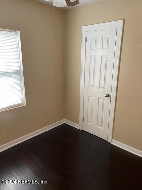 spare room featuring ceiling fan and hardwood / wood-style floors