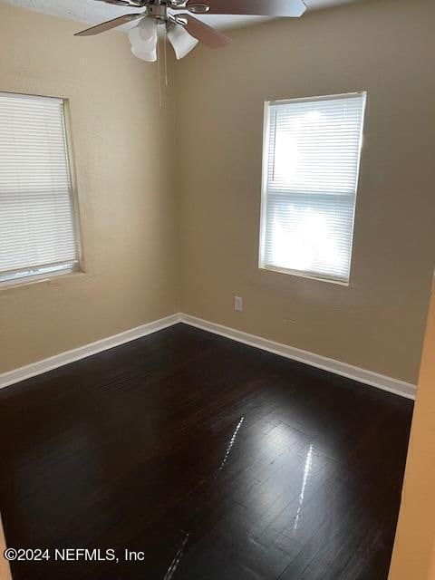 unfurnished room featuring ceiling fan and wood-type flooring