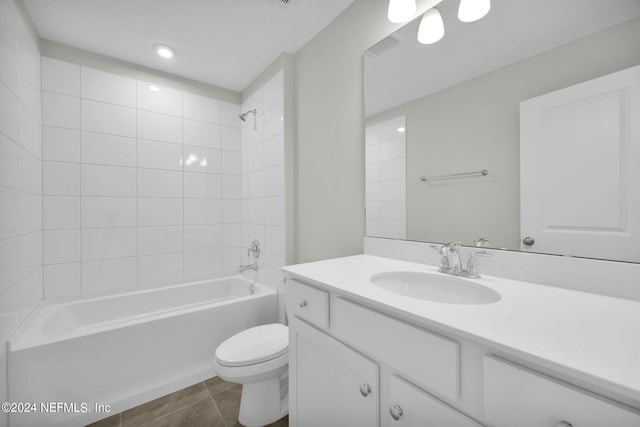 full bath with toilet, tile patterned floors, shower / tub combination, and vanity