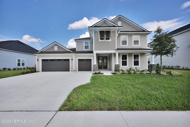 view of front facade featuring a garage, a porch, a front lawn, and concrete driveway