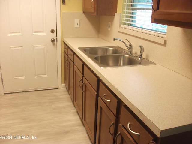 kitchen with sink and light wood-type flooring