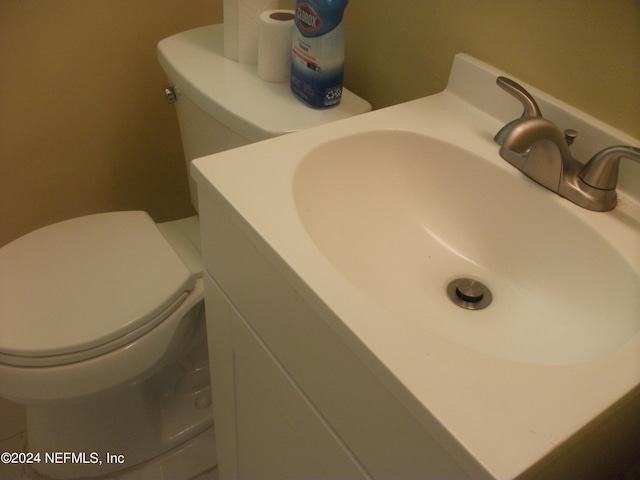 room details featuring vanity and toilet