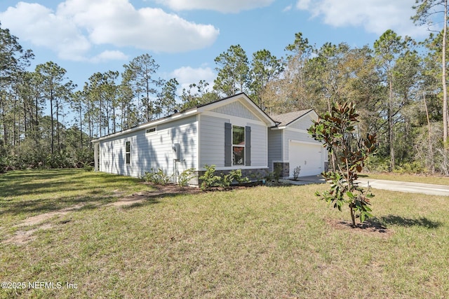 ranch-style house featuring a garage and a front yard