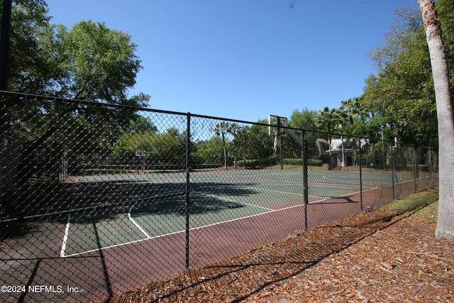 view of sport court featuring basketball hoop