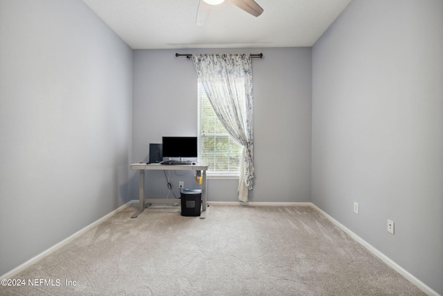 home office featuring carpet flooring and ceiling fan