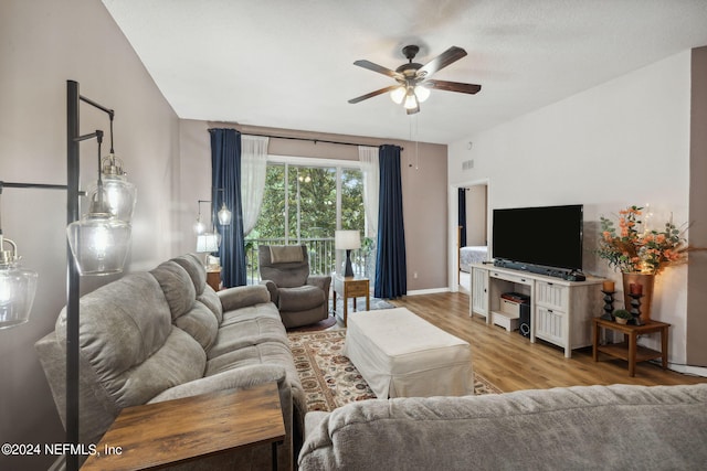 living room featuring ceiling fan and light hardwood / wood-style flooring