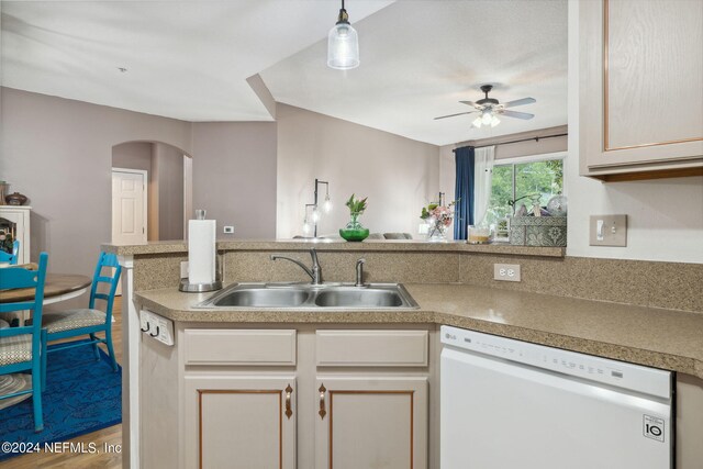 kitchen with dishwasher, ceiling fan, hanging light fixtures, and sink