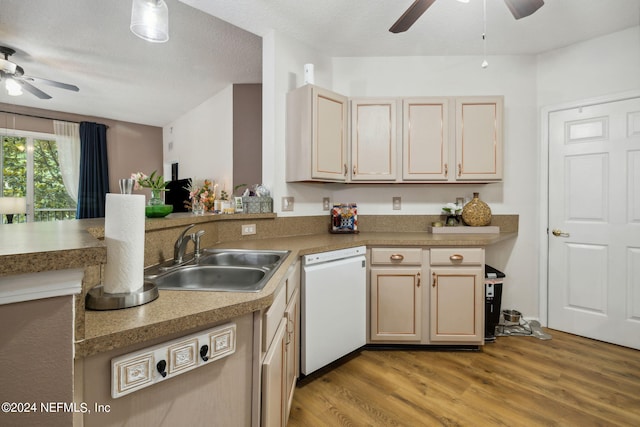 kitchen featuring a textured ceiling, sink, light brown cabinets, light hardwood / wood-style flooring, and dishwasher