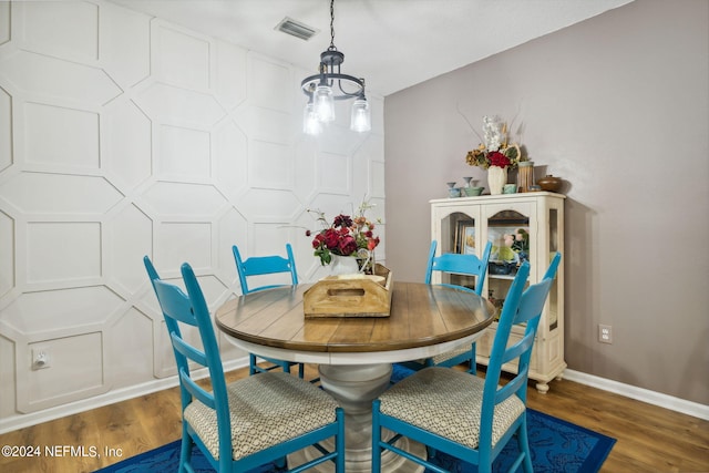 dining space featuring dark wood-type flooring