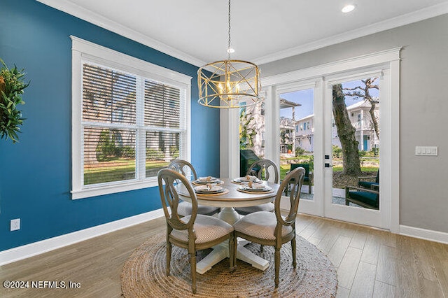 dining area featuring light hardwood / wood-style flooring, a chandelier, and a wealth of natural light