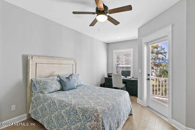 bedroom featuring light hardwood / wood-style flooring, ceiling fan, access to outside, and multiple windows