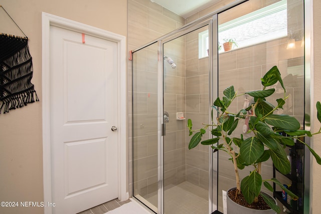 bathroom featuring an enclosed shower