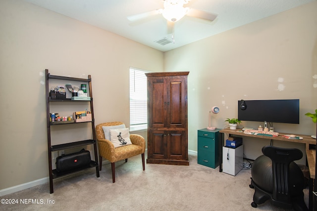 office space with light colored carpet and ceiling fan