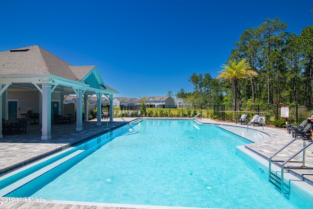 view of pool featuring a patio