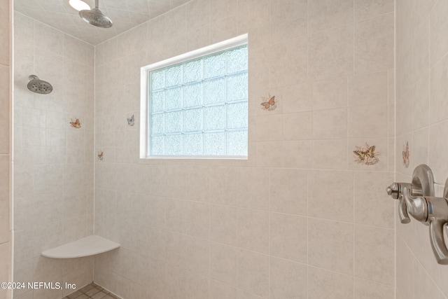 bathroom featuring tiled shower